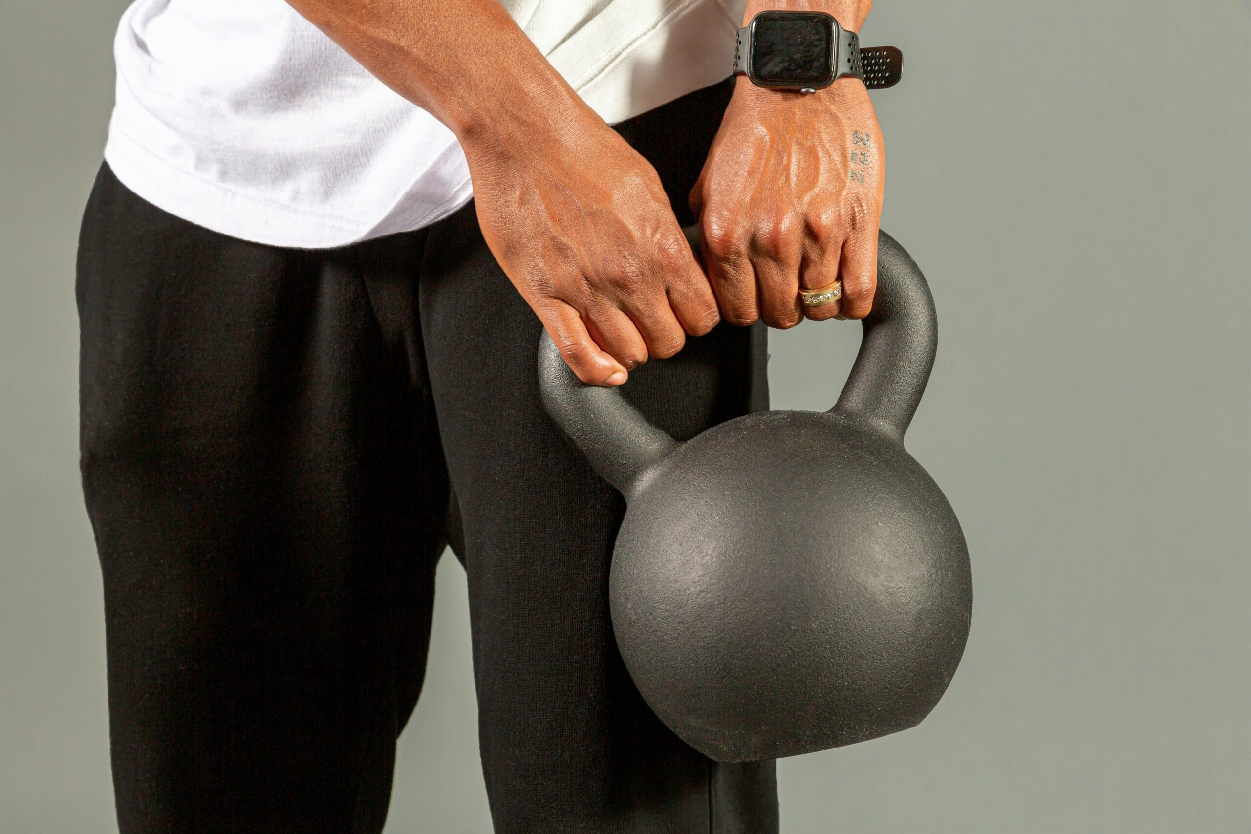 Comparison image showing differences between kettlebells and dumbbells