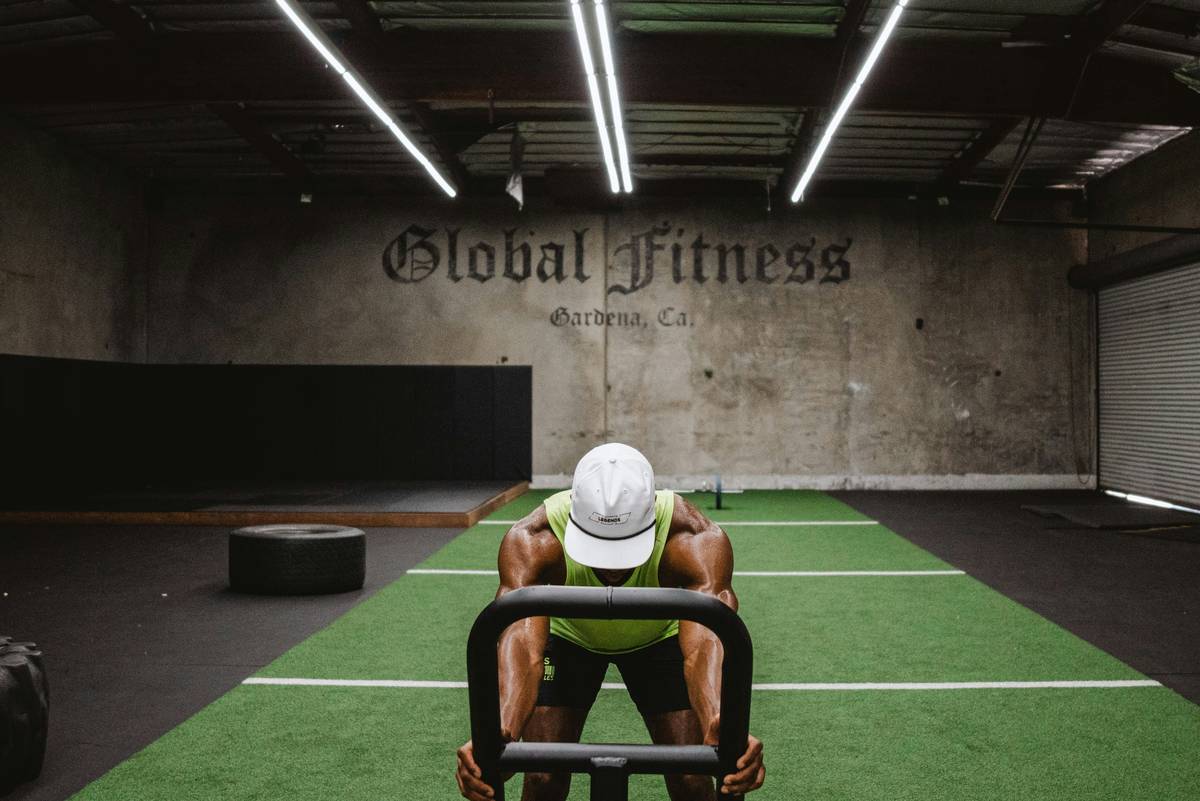 Demonstration of three basic kettlebell exercises: swings, goblet squats, and Turkish get-ups.