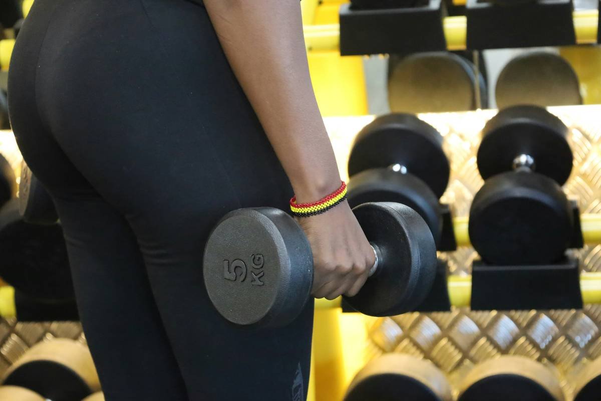 Woman demonstrating a kettlebell swing exercise
